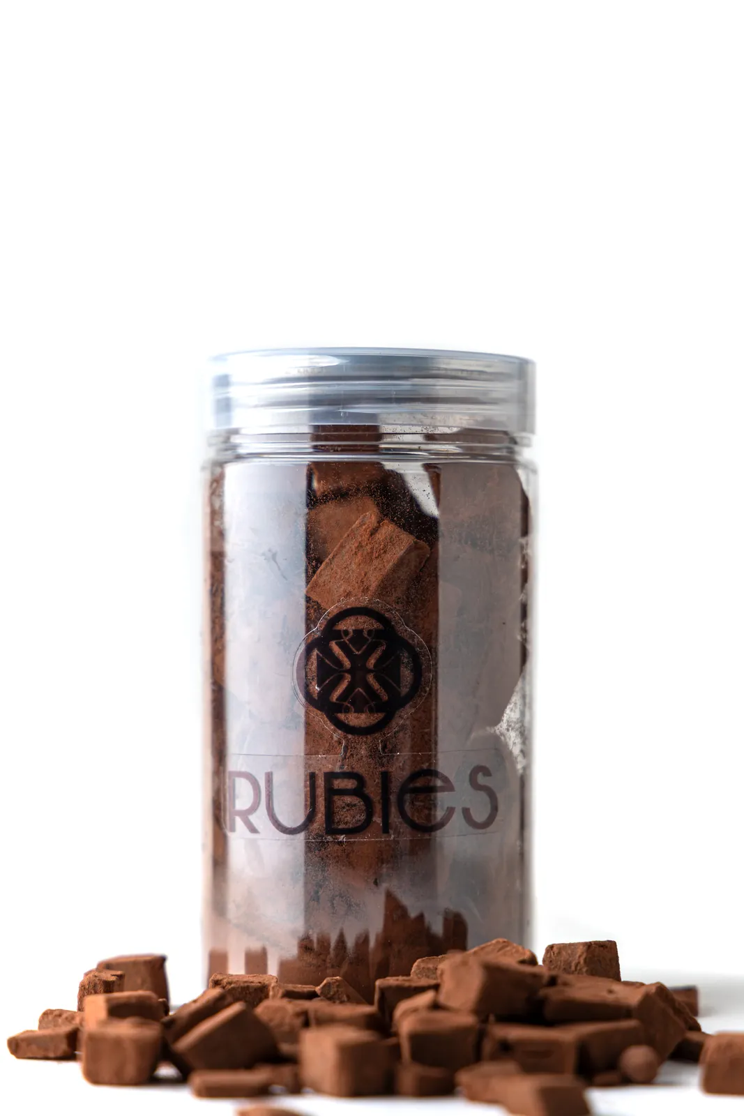 Clear Rubies jar filled with cocoa-dusted chocolate truffle cubes and loose pieces