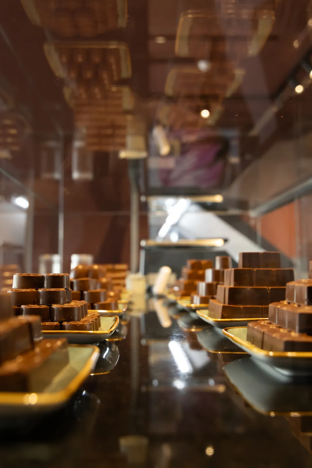 Reflective chocolate display counter at the Rubies shop